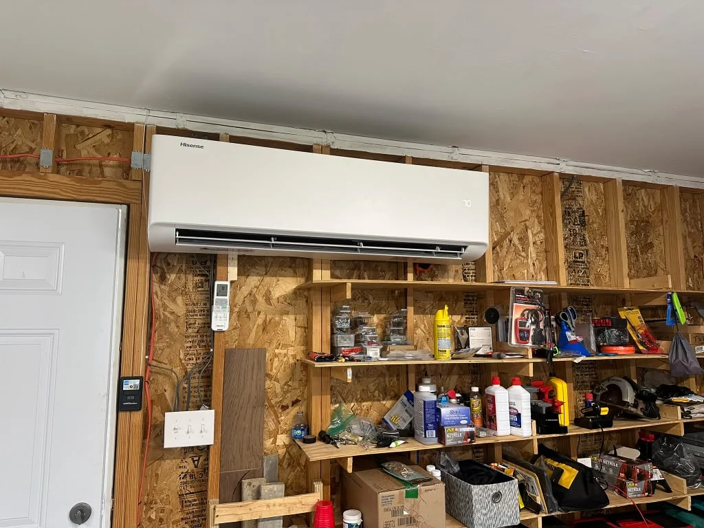 Wall-mounted ductless indoor unit in a workshop